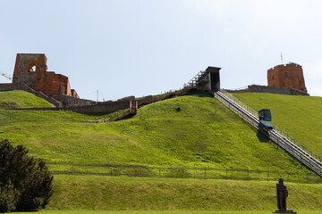 Historic buildings among green trees in a European city. A panoramic bird's-eye view of the historic city from the window of a tall old castle. June 1, 2025, Vilnius, Lithuania.