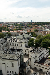 Beautiful city streets on a sunny summer day. Historic buildings among green trees in a European city. A panoramic view of the historic city from a bird's-eye perspective. June 1, 2025, Vilnius, Lithu