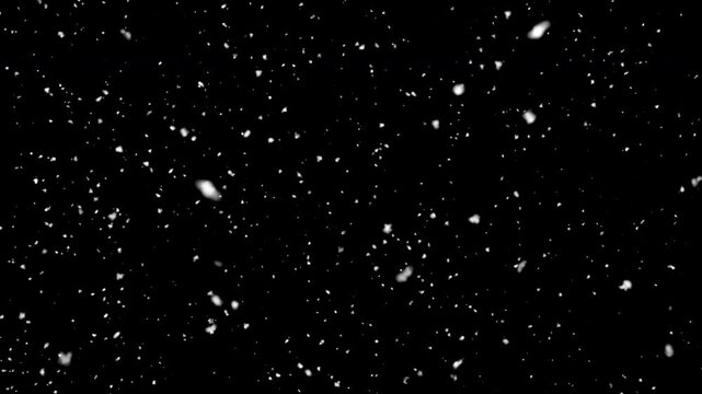 White snow overlay layer isolated on black background snowflakes bokeh, and snowfall for holiday design. 4k Seamless loop Isolated snow falling on black background