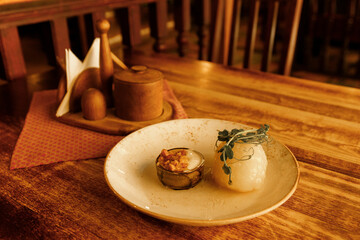 An authentic restaurant in a historic European city. Traditional Lithuanian dishes and a cup of coffee in a  old restaurant. Traditional Belarusian potato dishes. June 1, 2025, Vilnius, Lithuania