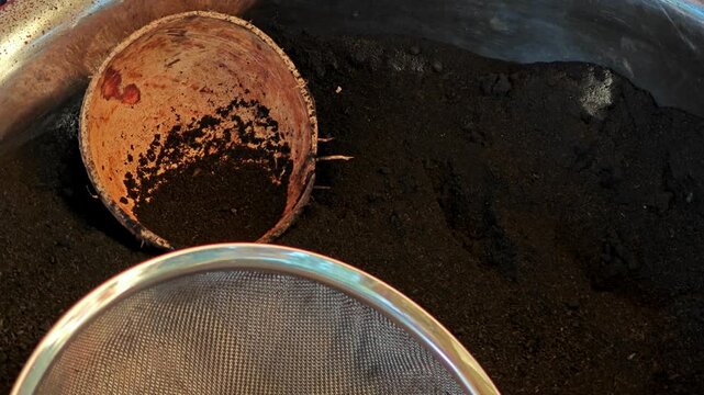 Pile of black charcoal powder.