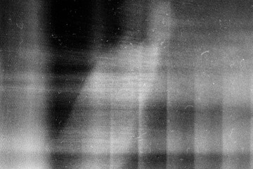 Stippled grain texture background. Black sprayed dots gradient wallpaper. Rough noisy sand dotted...