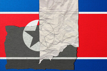 Distressed and layered, a fragmented flag evokes complex national identity with the use of textured paper and overlaid symbols, creating a sense of history and troubled present. The