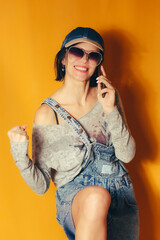 Happy woman celebrating good news on phone