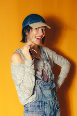 Smiling woman posing playfully with sunglasses