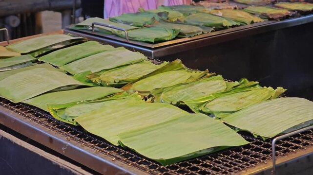 Thai coconut pancake grilled on banana leaves (or called Khanom Babin).