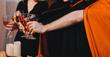 Friends enjoying a Halloween party at a bar making a toast