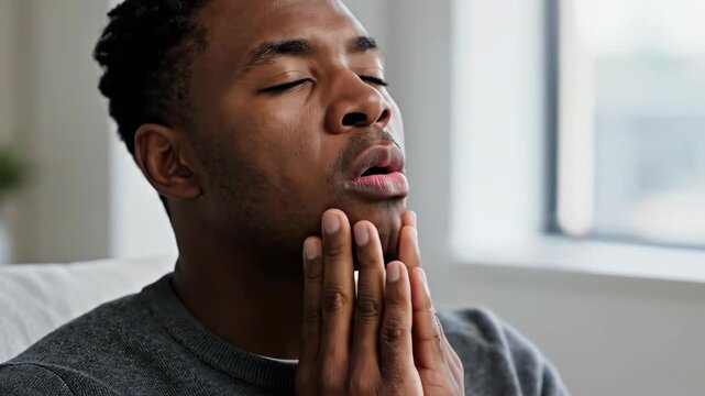 Man Experiencing Severe Toothache Or Other Oral Pain And Discomfort Indoors