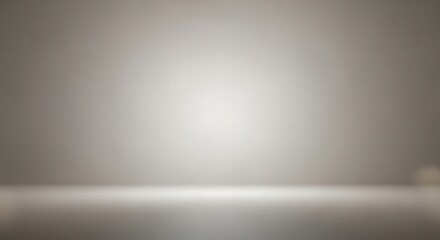 Smooth neutral background features a bright central spot light illuminating a reflective floor area