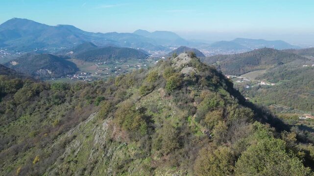 Aerial drone footage from Monte Ceva, Colli Euganei: rolling hills, volcanic peaks, forests and wide panoramic views. Ideal for nature, travel and landscape stock footage.