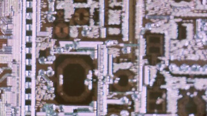 Microchip integrated circuit architecture under microscope