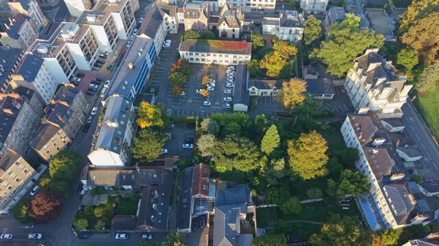Drone top-down view over Rennes Thabor district with trees, streets and buildings.