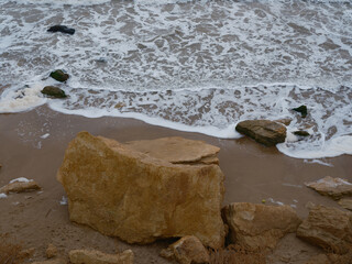 Overhead View to Sea Foam and Sandstone Rock