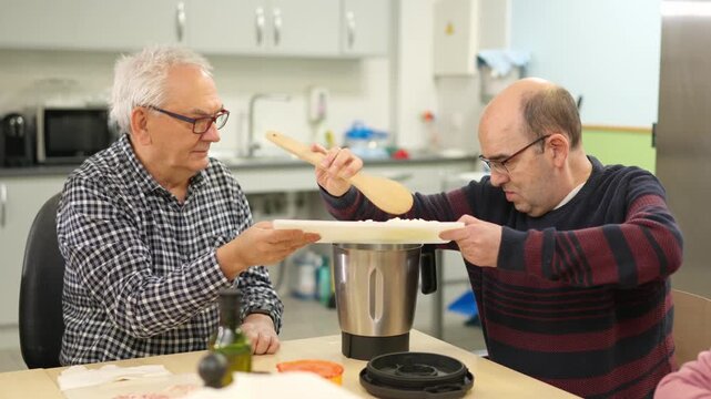People with physical disabilities cooking together in a kitchen
