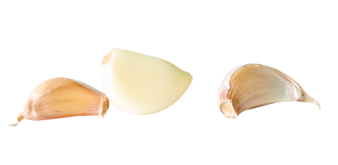 Side view set of three garlic cloves in heap isolated with clipping path in png file format