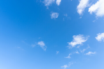 Low angle view and full frame of beautiful blue sky with strange shape of fluffy white clouds in the afternoon on sunny day used as natural background texture in decorative art work