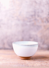 Traditional japanese ceramic on rustic wooden background. Soft focus. Copy space.	