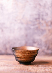 Traditional japanese ceramic on rustic wooden background. Soft focus. Copy space.	