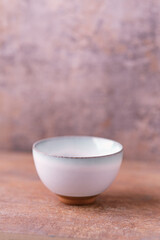 Traditional japanese ceramic on rustic wooden background. Soft focus. Copy space.	