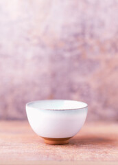 Traditional japanese ceramic on rustic wooden background. Soft focus. Copy space.	