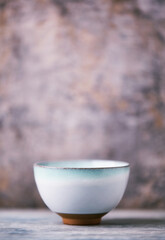 Traditional japanese ceramic on rustic wooden background. Soft focus. Copy space.	
