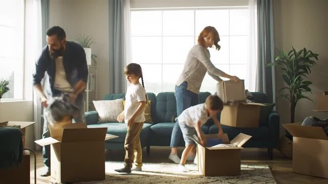 Family moving into new home unpacking cardboard boxes and furniture