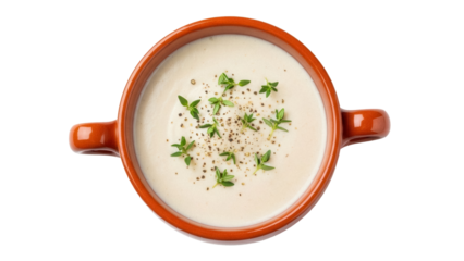 Creamy potato leek soup in terracotta bowl isolated PNG, garnished with thyme and black pepper for healthy eating and comfort food