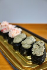 Kanimiso (crab tomalley) nigirizushi purchased at a supermarket in Tokyo, Japan