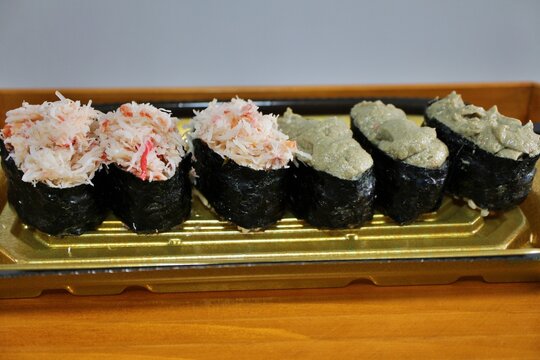 Snow crab and kanimiso (crab tomalley) nigirizushi purchased at a supermarket in Tokyo, Japan