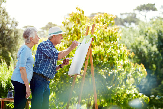 Happy, painting and senior couple outdoor for bonding with art hobby, creativity and artwork. Retirement, marriage and elderly man and woman with canvas for drawing, picture or inspiration in park