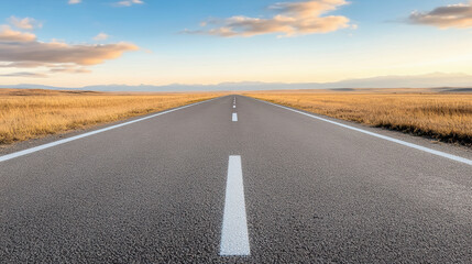 Obraz premium Empty road leading to distant horizon with golden field and sunrise sky