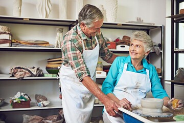 Pottery, workshop and old couple with clay, happy and bonding with creative hobby, romance and love. Elderly man, smile and senior woman with skills for craftsmanship, art process and people on date