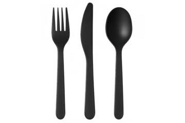 Black plastic cutlery set presenting an eating concept, including a fork, knife, and spoon, on a transparent background