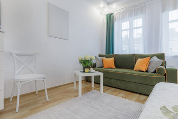 Bright Cozy Living Area with Green Sofa and Soft Natural Light