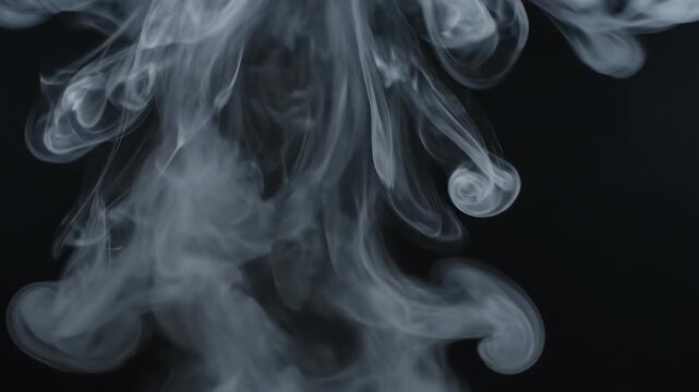 Ultra slow motion dramatic white smoke rising and dissolving into a solid black studio background black background, dynamic, fog