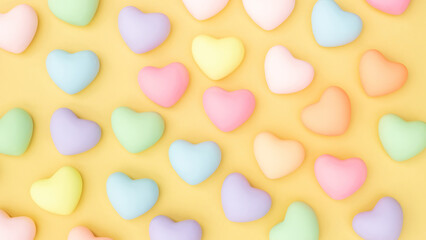 Colorful heart jelly on a yellow background.