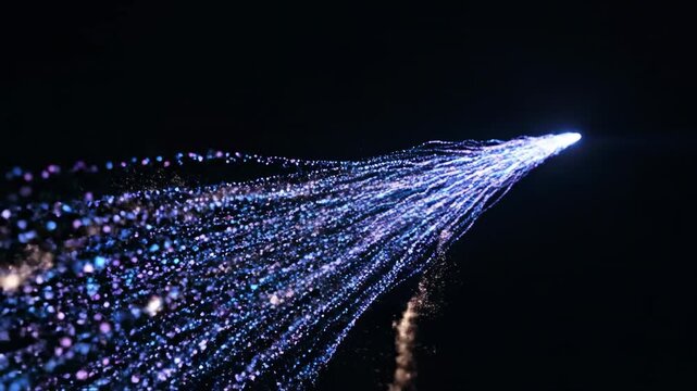 Abstract glowing particles flowing in a smooth stream of light energy simulating electromagnetic field transfer on a black backdrop vfx, communication, fluid
