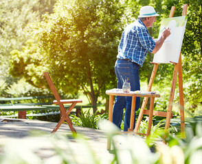 Old man, painter and canvas at park with project, process and talent with brush stroke in summer. Senior person, easel and drawing in nature, inspiration and design artwork with skills in retirement