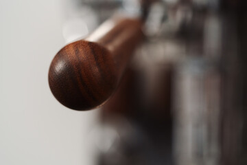 Closeup detail shot of walnut wood handles on coffee machine