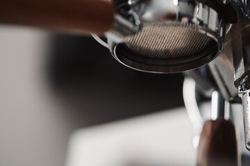 Closeup detail shot of coffee machine with walnut wood handles