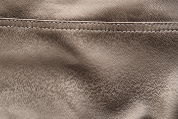 Closeup texture full grain gray brown leather with seam