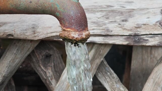 Water from hand pump in hand-dig well, providing groundwater or underground water