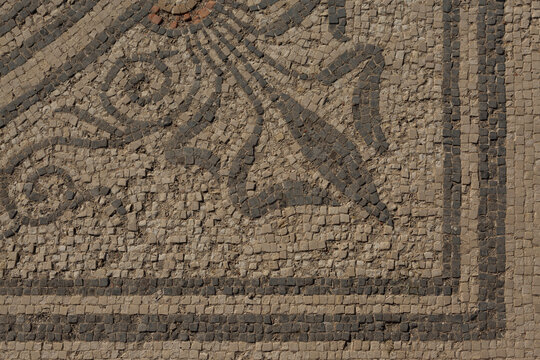 A background with a decorative mosaic pattern preserved from ancient times