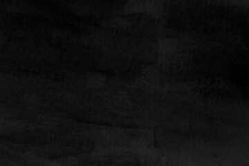 Macro close-up of hand painted black watercolor background with watercolour stains. High resolution full frame textured paper background in black and white. Copy space.