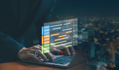 A businessman using a laptop with a digital project management dashboard. Concept of business project planning, scheduling time, timeline design, Gantt charts on control software