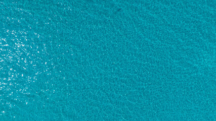 Aerial view of the Overhead view of crystal clear water on beach background	