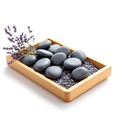 Spa stones with lavender flowers in wooden tray for relaxation and wellness zen garden concept
