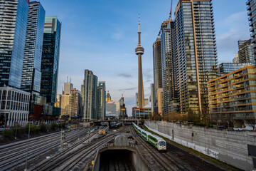 Commuter train tracks leading into downtown Toronto skyline © Emad Aljumah