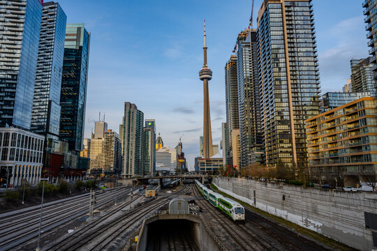 Commuter train tracks leading into downtown Toronto skyline