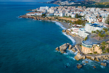 Fototapeta premium Aerial View of the Balcón de Europa Lookout Point and the Dramatic Coastline of Nerja, Andalusia, on the Mediterranean Sea